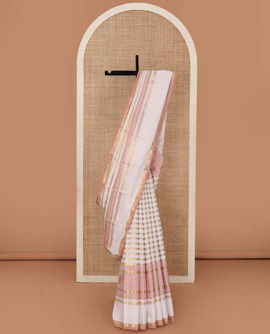 Cream-pink Kanchipuram silk saree features Muthu stripes,mayil kann, and neli designs, rettai pettu mayil kann border, and zari woven pallu