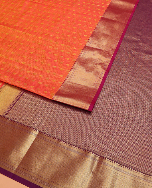 Orange Vasundhara Lite Silk Mix Saree Elevated with Thilakam Buttas, Highlighted with Contrast Border Featuring Thilakam, Banaras, and Vanki Designs, Grandly Woven Pallu with Vanki Designs, and Paired with a Matching Blouse