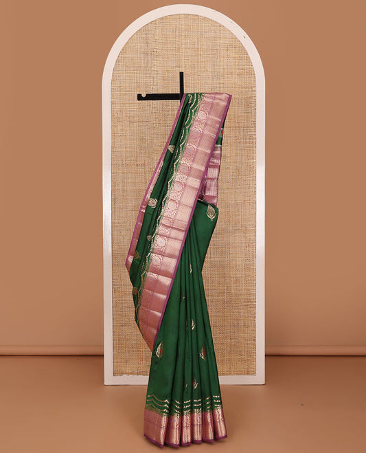 Dark green floral meena buttas raw mango silk saree, contrast floral design border creeper, and floral design pallu