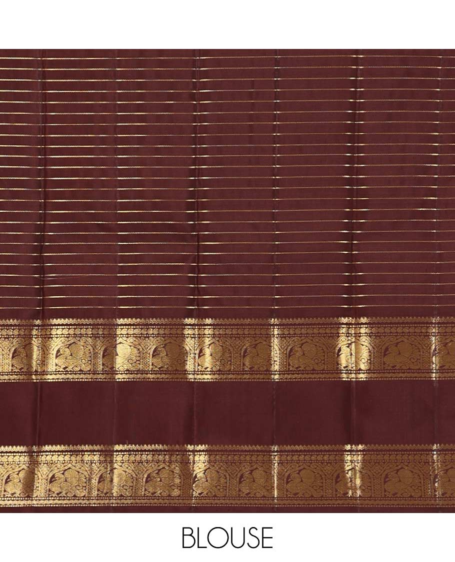 Orange zari buttas and stripes Kanchipuram silk saree, contrast rettai pettu border of thilakam mokku, muthu, manga, and mayil designs, and jaal pallu