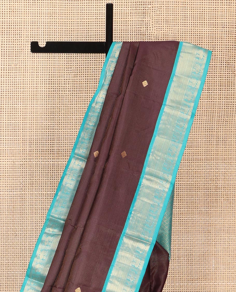 Brown Vasundhara Silk Saree, Charmingly Accented with Stripes and Zari Buttas All Over Its Body, Complemented by a Contrast Border of Rekku, Neli, Kuyil Kann, and Mayil Designs, Grand Jaal Pallu, and Paired with a Contrast Blouse