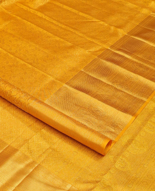 Yellow floral jaal jacquard wedding silk saree, traditional zari design border, and jaal design pallu