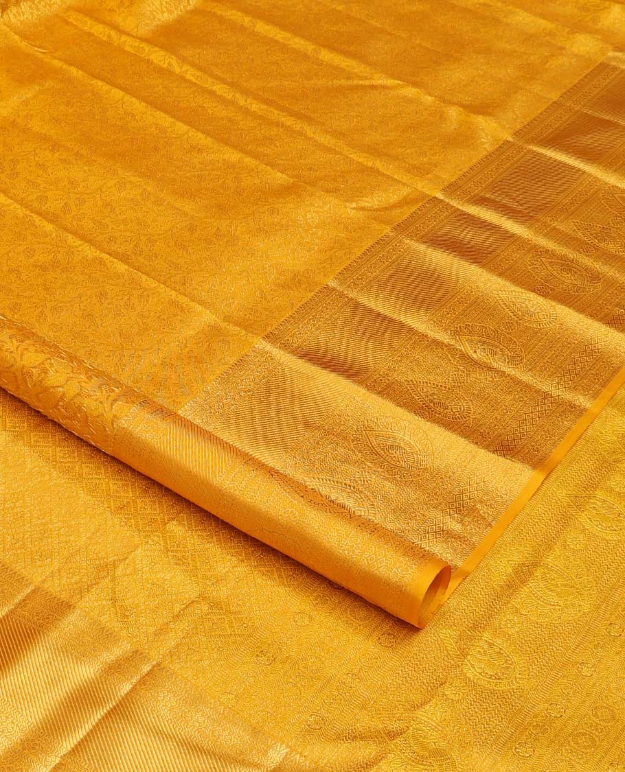 Yellow floral jaal jacquard wedding silk saree, traditional zari design border, and jaal design pallu
