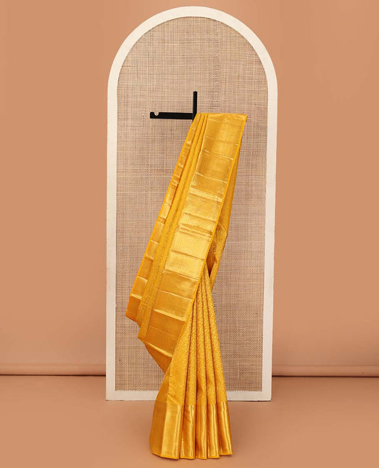 Yellow floral jaal jacquard wedding silk saree, traditional zari design border, and jaal design pallu