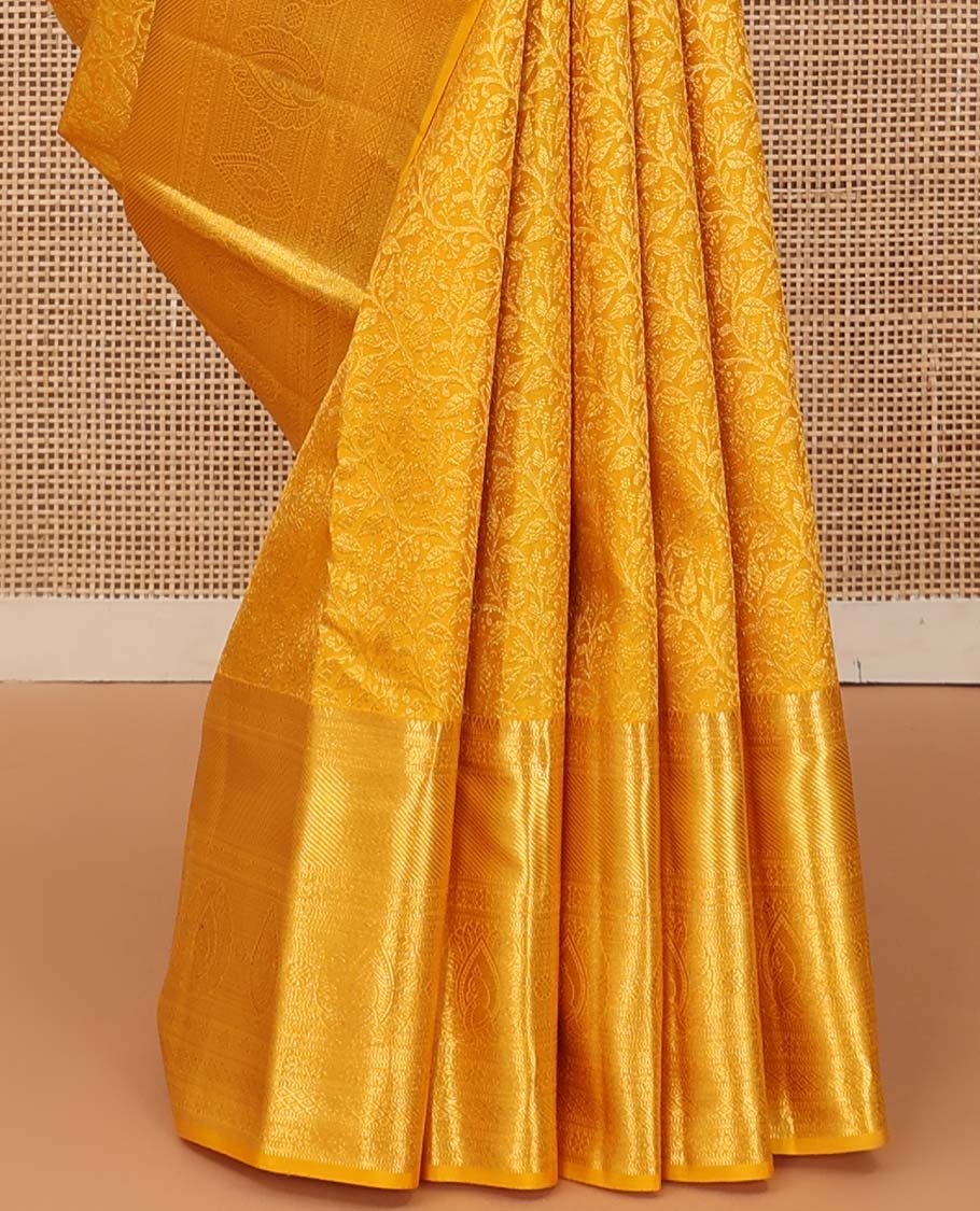 Yellow floral jaal jacquard wedding silk saree, traditional zari design border, and jaal design pallu