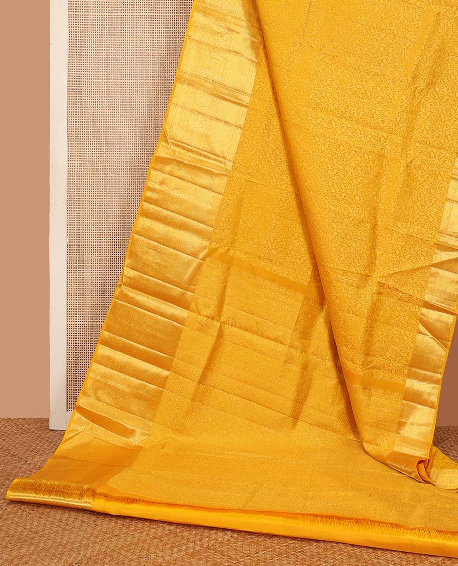 Yellow floral jaal jacquard wedding silk saree, traditional zari design border, and jaal design pallu