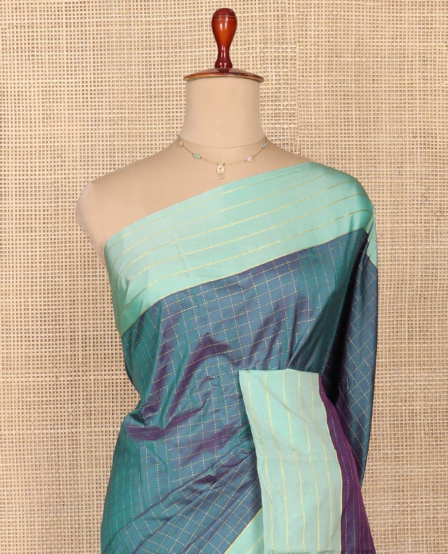 Blue Aarani Silk Saree, Dazzled with Butta Enclosed Checked Design on Its Body, Complemented by a Contrast Zari Striped Border, Pallu of Butta Enclosed Checks, and Paired with a Matching Blouse