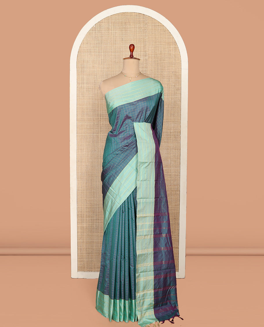 Blue Aarani Silk Saree, Dazzled with Butta Enclosed Checked Design on Its Body, Complemented by a Contrast Zari Striped Border, Pallu of Butta Enclosed Checks, and Paired with a Matching Blouse