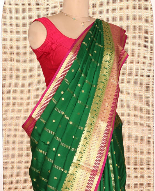 Green Mysore Silk Saree, Artfully Detailed with Zari Buttas and Stripes, a Contrast Traditional Zari Border, Intricately Designed Pallu, and a Contrast Blouse