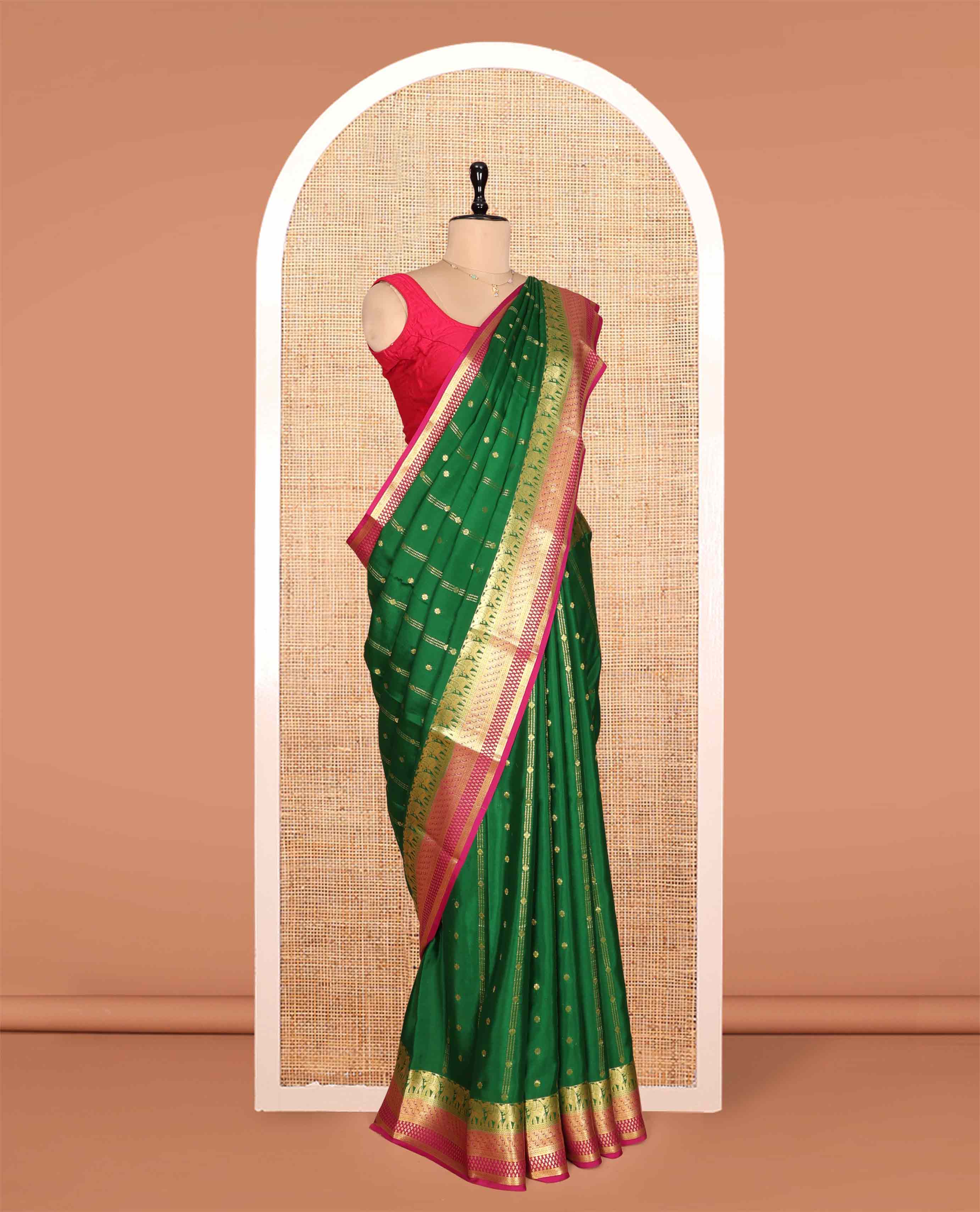 Green Mysore Silk Saree, Artfully Detailed with Zari Buttas and Stripes, a Contrast Traditional Zari Border, Intricately Designed Pallu, and a Contrast Blouse