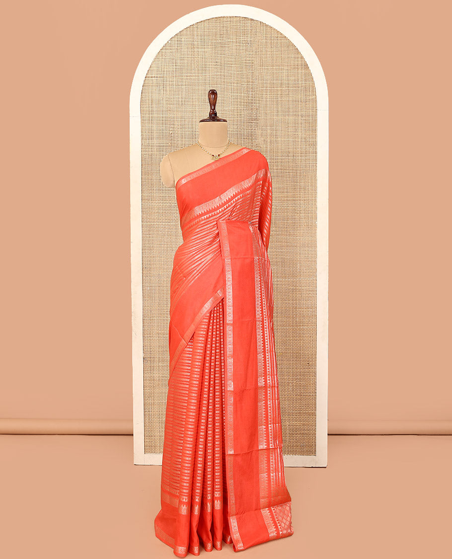 Orange Assam Silk Saree, Beautifully Detailed with Zari Designs All Over Its Body, Highlighted by a Zari Border of Traditional Designs, a Gleaming Pallu of Ogee Patterns, and Paired with a Matching Blouse