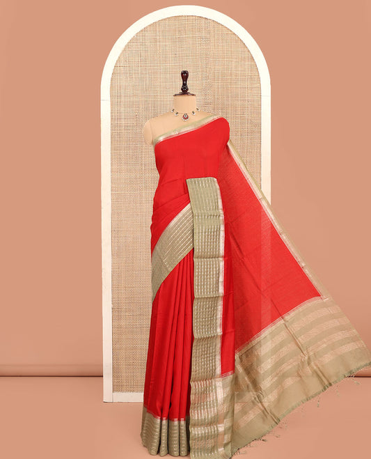 Red Plain Assam Silk Saree, Complemented by a Contrast Zari Border of Stripes, Pallu Gleamed Up with Zari Stripes, and Paired with a Contrast Blouse