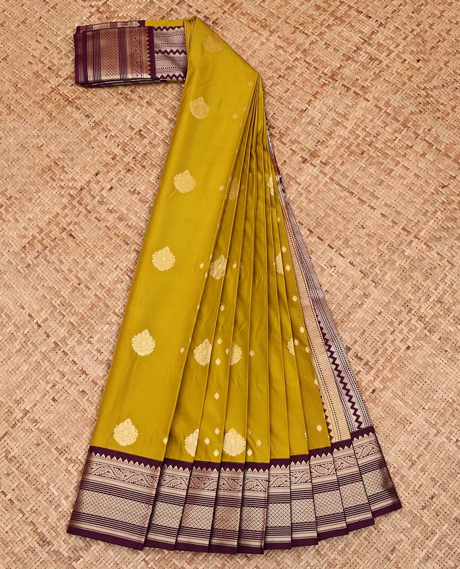 Green Budget Silk Saree, Detailed with Zari Buttas All Over Its Body, Complemented by a Contrast Zari Border of Traditional Designs, Pallu Steeped with Geometric Designs, and Paired with a Contrast Blouse