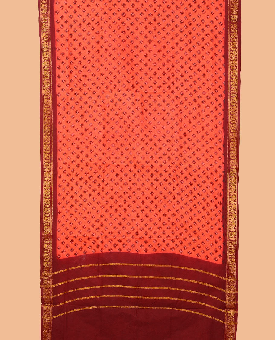 Orange buttas nine-yard cotton saree, contrast traditional zari border, and zari striped pallu
