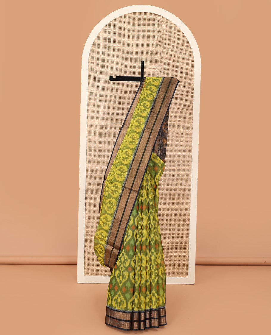 Green Pochampally Ikkat-style ogee patterned silk cotton saree, contrast bavanji zari border, and ikkat design pallu