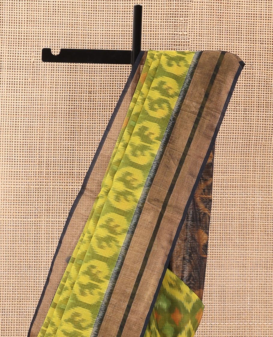 Green Pochampally Ikkat-style ogee patterned silk cotton saree, contrast bavanji zari border, and ikkat design pallu