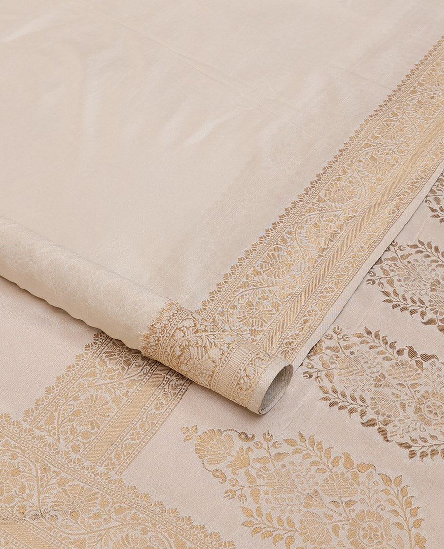 Cream plain design saree, zari border of floral designs, and Mughal-style pallu of zari floral designs