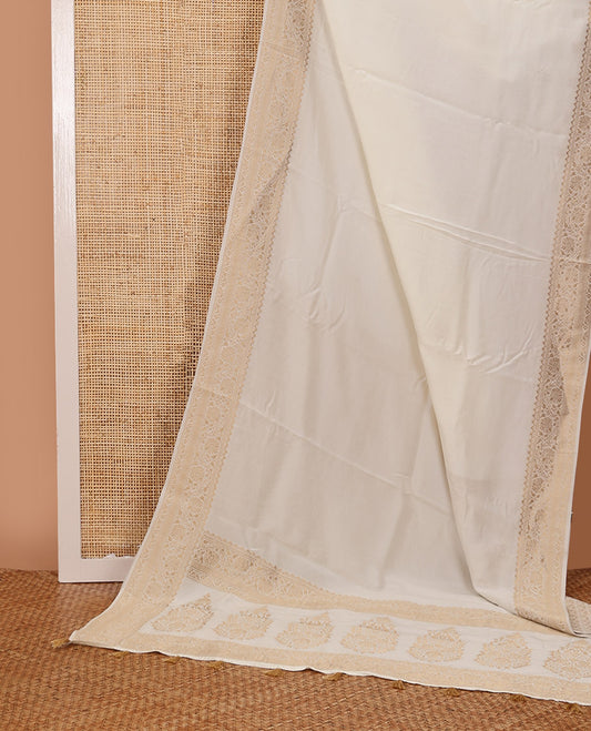 Cream plain design saree, zari border of floral designs, and Mughal-style pallu of zari floral designs