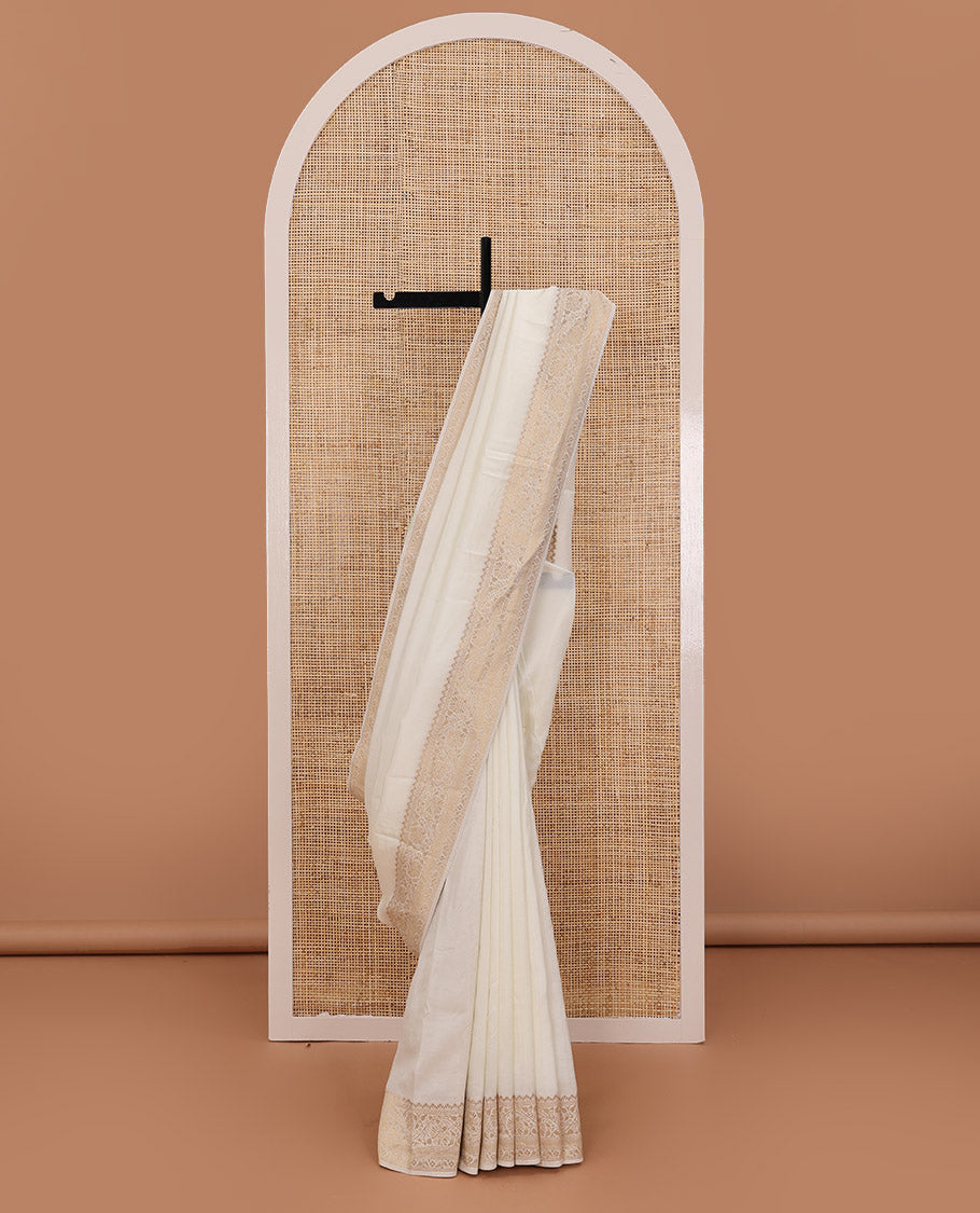 Cream plain design saree, zari border of floral designs, and Mughal-style pallu of zari floral designs