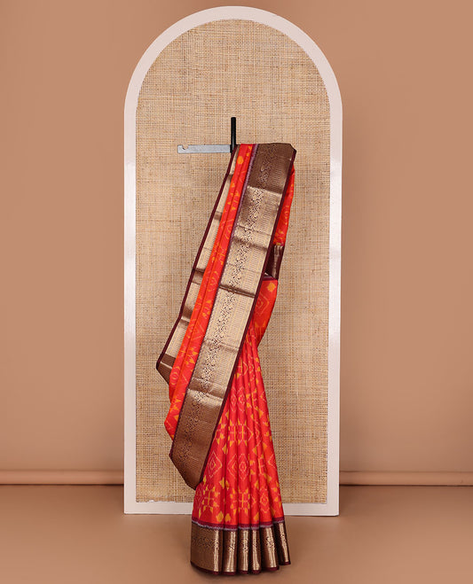 Orange jaal-patterned pure ikkat saree, contrast traditional zari kanchi border & pallu of zari geometric designs