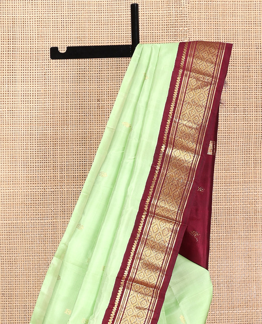 Green Kanchipuram Silk Saree, Graced with Zari Buttas, Contrast Korvai Border of Thilakam Mokku, Banaras, Muthu, and Jaal, Zari Design Pallu, and No Blouse