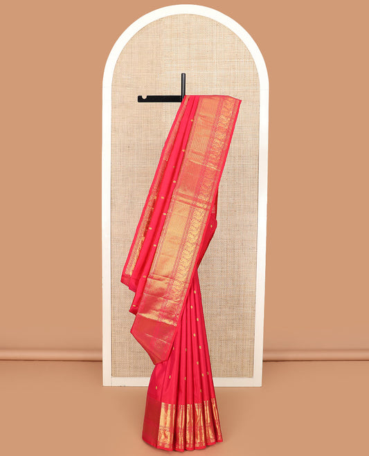 Red zari buttas Kanchipuram silk saree, zari border of muthu, neli, mayil, and mayil kann designs, and chakram design pallu