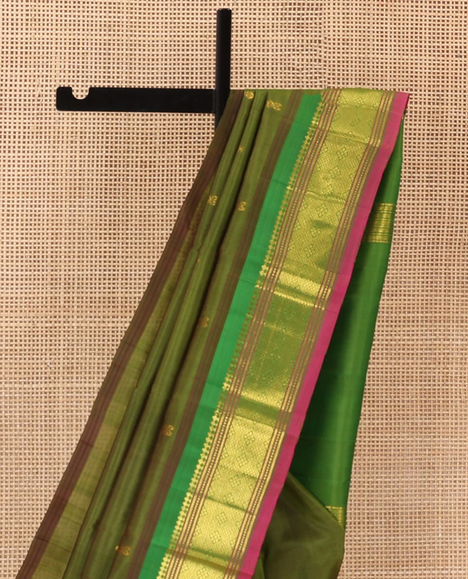 Green zari buttas Kanchipuram silk saree, contrast one-sided border of panner sombu, muthu, banaras and jaal designs, and zari design pallu