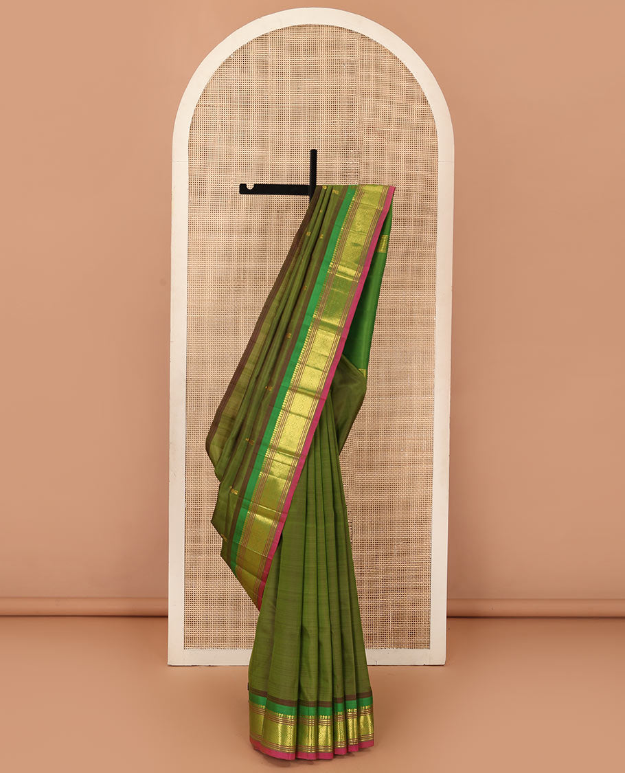 Green zari buttas Kanchipuram silk saree, contrast one-sided border of panner sombu, muthu, banaras and jaal designs, and zari design pallu