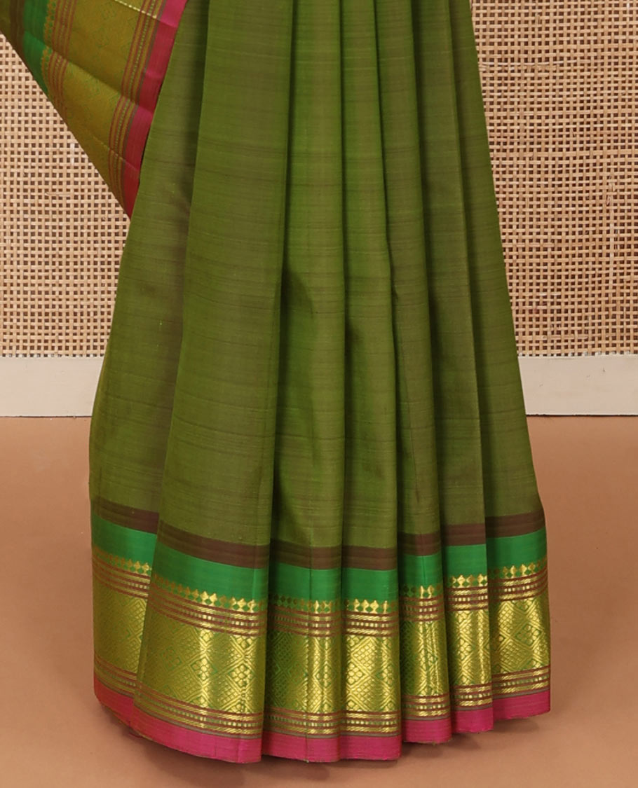 Green zari buttas Kanchipuram silk saree, contrast one-sided border of panner sombu, muthu, banaras and jaal designs, and zari design pallu
