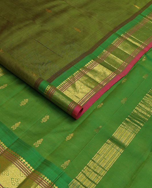 Green zari buttas Kanchipuram silk saree, contrast one-sided border of panner sombu, muthu, banaras and jaal designs, and zari design pallu