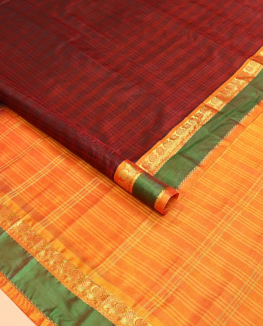 Red checked Kanchipuram silk saree, contrast rettai pettu border of manga, neli, and mayil kann designs, and striped pallu