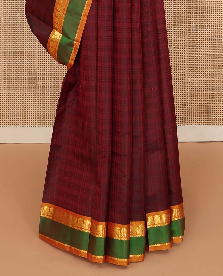 Red checked Kanchipuram silk saree, contrast rettai pettu border of manga, neli, and mayil kann designs, and striped pallu