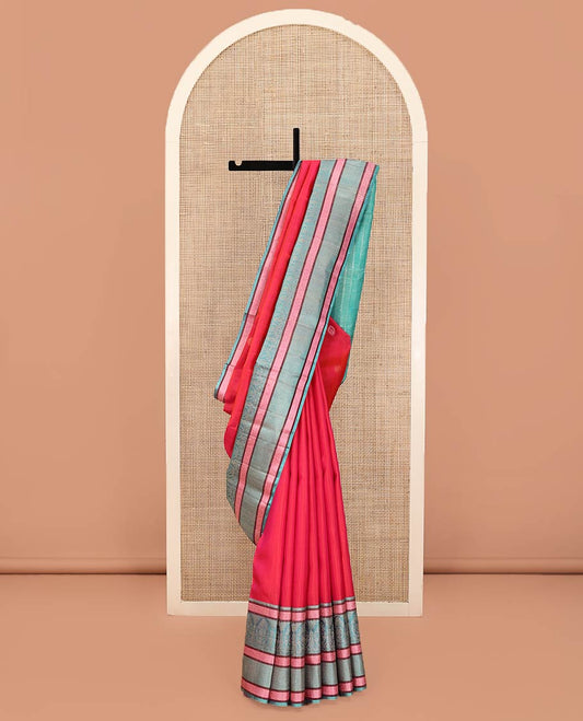 Red Kanchipuram Designer Silk Saree, Subtly Adorned with Buttas All Over Its Body, Complemented by a Captivating Contrast Border of Mughal-Style Designs, Geometric-Patterned Zari-Woven Pallu, and Paired with a Contrast Blouse