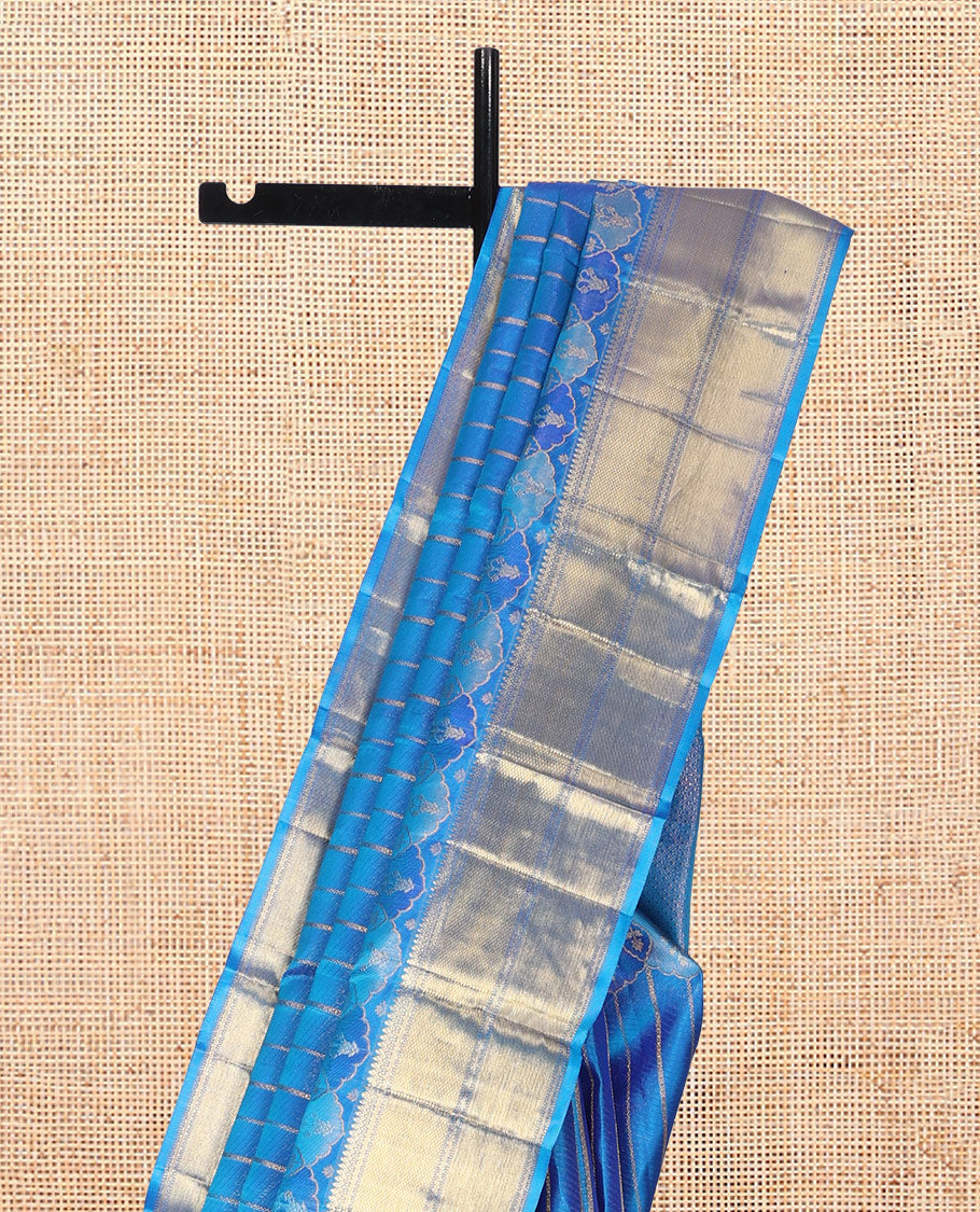 Blue Kanchipuram Designer Silk Saree, Gleamed Up with Zari Stripes, a Zari Border of Thilakam Mokku, Muthu, Rettai Neli, and Kuyil Kann Designs, Intricate Pallu, and a Matching Blouse