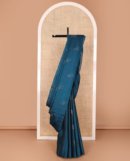 Borderless blue zari buttas soft silk saree, zari-rich pallu steeped with traditional zari designs