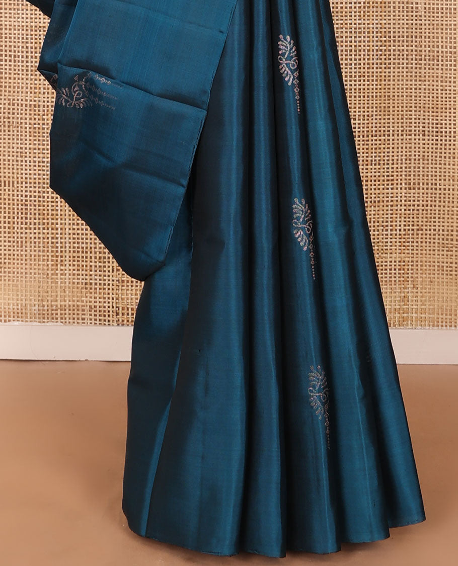 Borderless blue zari buttas soft silk saree, zari-rich pallu steeped with traditional zari designs