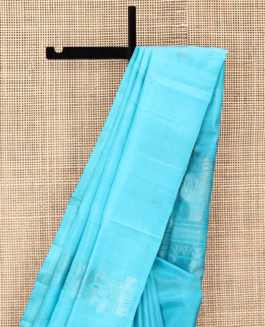 Borderless Blue Mayuri Soft Silk Saree, Beautified with Zari Buttas All Over Its Body, Sparsely Woven Pallu of Jaal and Floral Designs, and Paired with a Matching Blouse