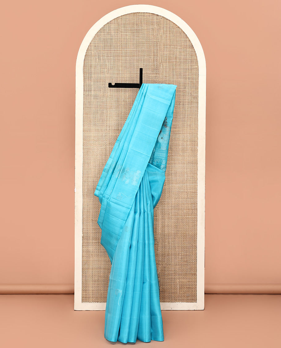 Borderless Blue Mayuri Soft Silk Saree, Beautified with Zari Buttas All Over Its Body, Sparsely Woven Pallu of Jaal and Floral Designs, and Paired with a Matching Blouse