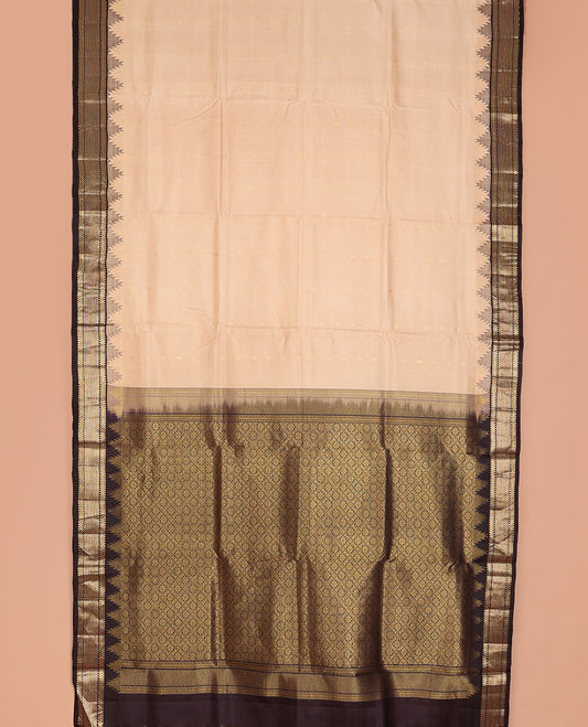 Sandal nine-yard silksaree with zari buttas,contrast thazampoo reku border of ara bogudi,muthu & ara maadam & jaal pallu