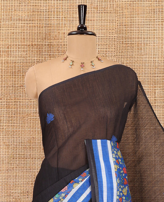 Black floral motifs printed linen cotton saree with contrast kalamkari floral vine printed border, floral vine printed pallu, and a plain blouse