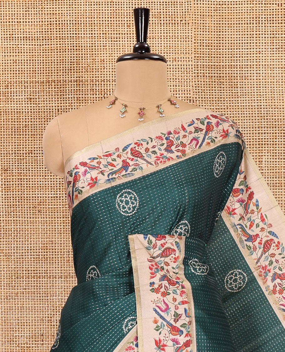 Green zari buttas and bandhani dotted fancy tussar saree, contrast floral and bird printed border, striped pallu, and a matching blouse