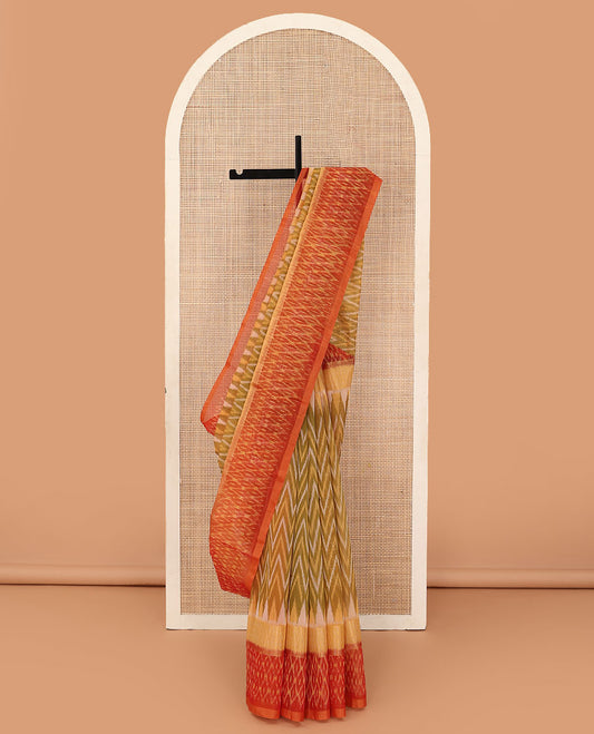 Green ikkat chevron design silk cotton saree, contrast zari bavanji border of ikkat jaal design, and pallu of jaal design