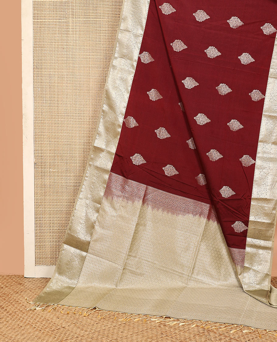 Maroon zari buttas soft silk saree, contrast traditional zari design border, and pallu of jaal design
