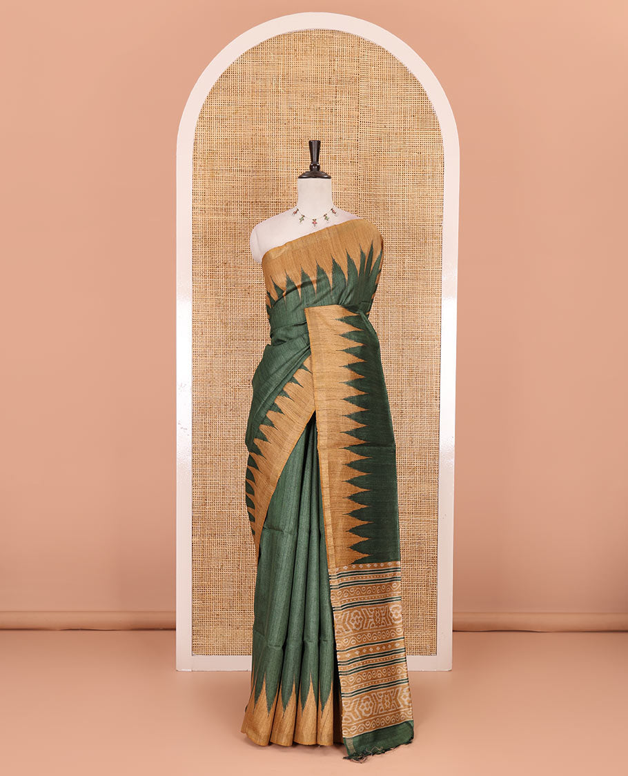 Green plain tussar silk saree, contrast temple border, and ikkat design pallu