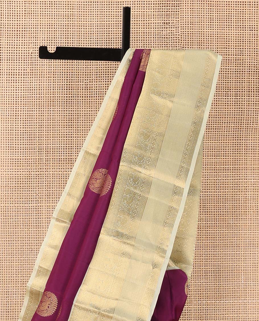 Maroon zari buttas Vasundhara silk mix saree, contrast border of thilakam, muthu, diamond, neli, and mayil designs, and jaal pallu