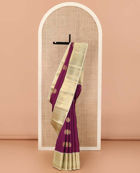 Maroon zari buttas Vasundhara silk mix saree, contrast border of thilakam, muthu, diamond, neli, and mayil designs, and jaal pallu