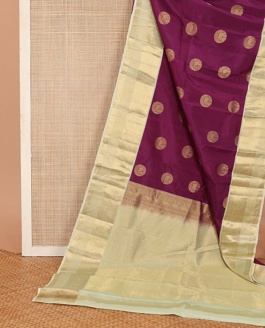Maroon zari buttas Vasundhara silk mix saree, contrast border of thilakam, muthu, diamond, neli, and mayil designs, and jaal pallu