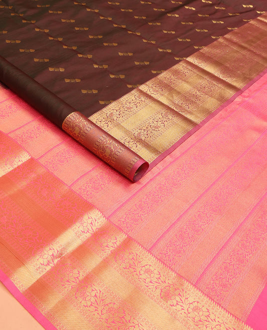 Brown Vasundhara Lite Silk Mix Saree Spotlighted with Zari Buttas, Featuring a Contrasting Zari-Woven Border with Rekku, Muthu, Kathir, and Kodi Visiry Designs, a Delicately Woven Pallu with Kodi Visiry Design, Paired with a Contrast Blouse