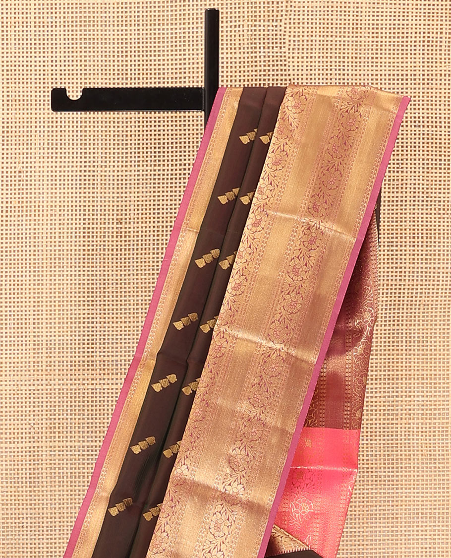 Brown Vasundhara Lite Silk Mix Saree Spotlighted with Zari Buttas, Featuring a Contrasting Zari-Woven Border with Rekku, Muthu, Kathir, and Kodi Visiry Designs, a Delicately Woven Pallu with Kodi Visiry Design, Paired with a Contrast Blouse