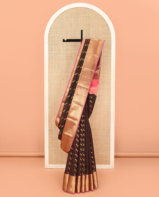 Brown Vasundhara Lite Silk Mix Saree Spotlighted with Zari Buttas, Featuring a Contrasting Zari-Woven Border with Rekku, Muthu, Kathir, and Kodi Visiry Designs, a Delicately Woven Pallu with Kodi Visiry Design, Paired with a Contrast Blouse
